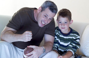 resized dad watching football with son