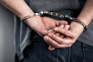 arrested man in handcuffs
